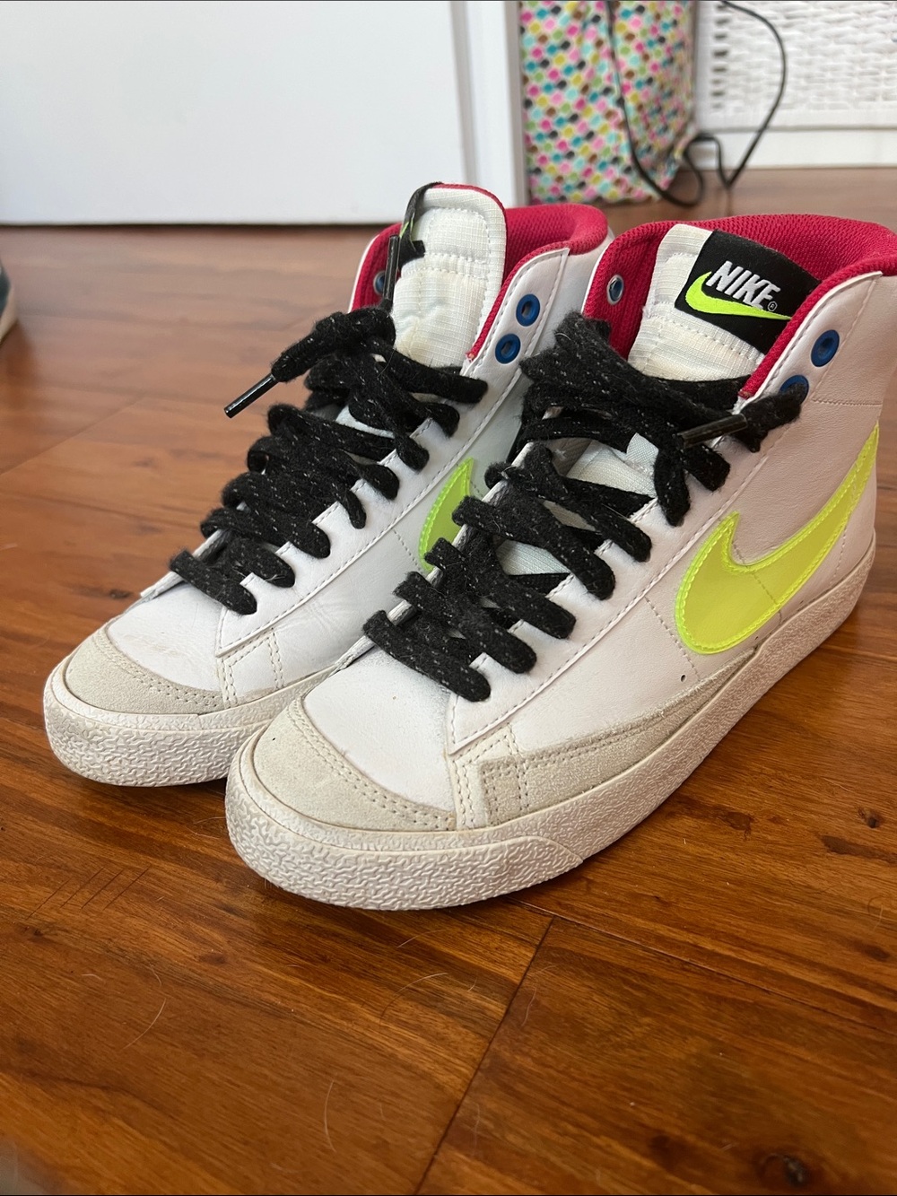 Nike White Mid-Top Sneakers with Neon Yellow Swoosh and Black Laces